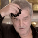Gigi Becali a primit interdicția de a mai cânta la strană